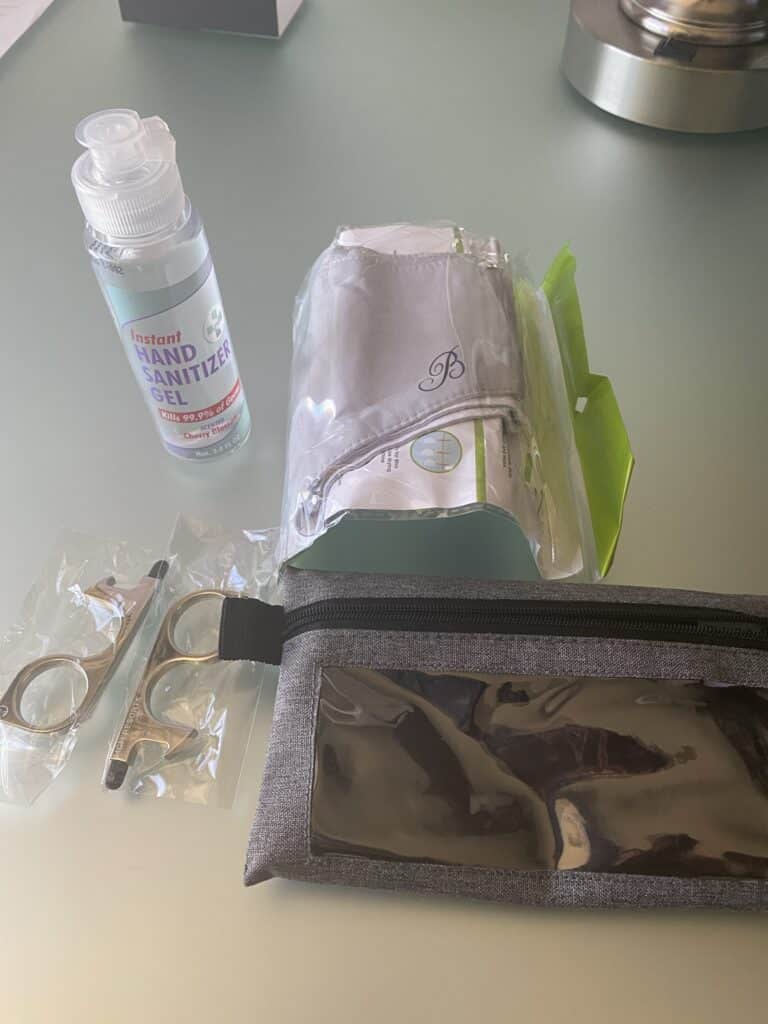 Bellagio Stay Well King Room Tour - covid safety kit with hand sanitizer gel, face masks, button pushers, and a resusable zipper bag