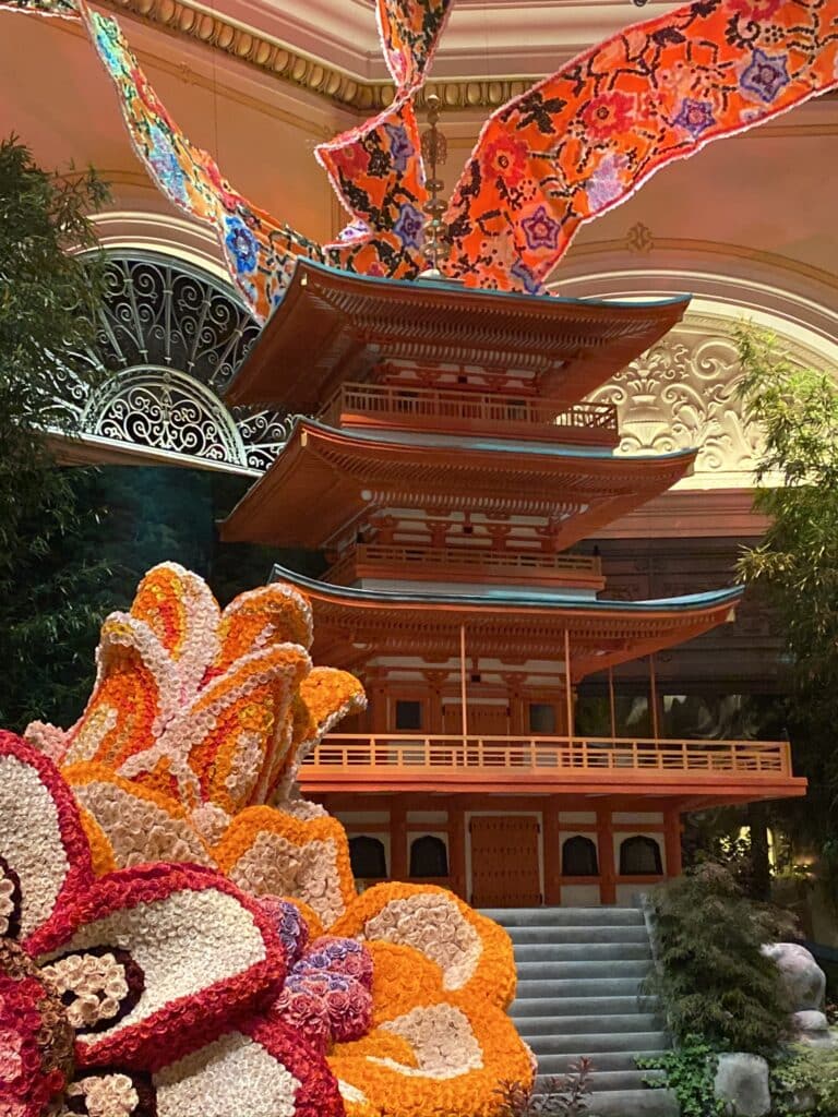 Bellagio Conservatory lunar new year theme with flowers, banners, and a pagoda