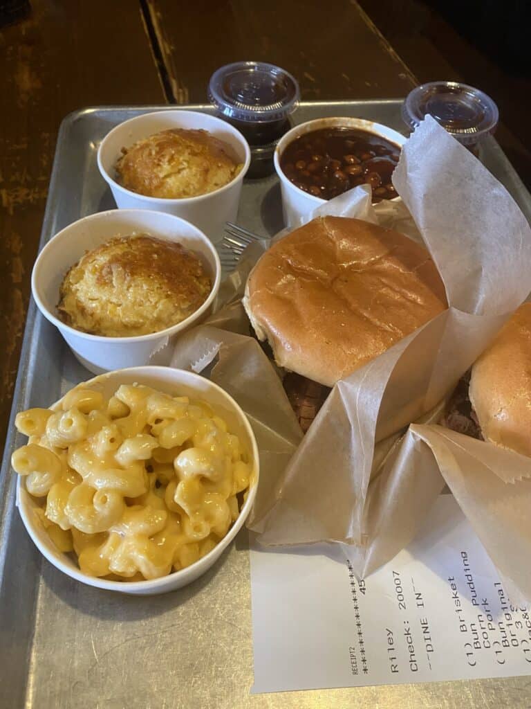 2 pulled pork sandwiches, 2 corn puddings, mac n cheese, and baked beans from City BBQ