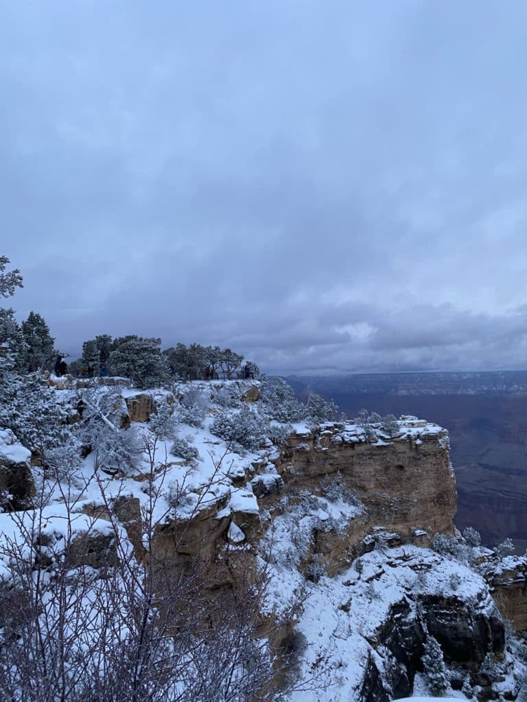 sunrise at Grand Canyon covered in snow 
