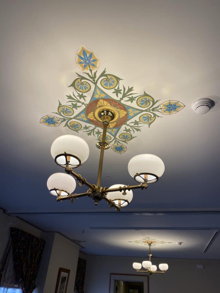 William Howard Taft National Historic Site in Cincinnati Ohio - decorative pattern painted into the ceiling above a vintage chandelier