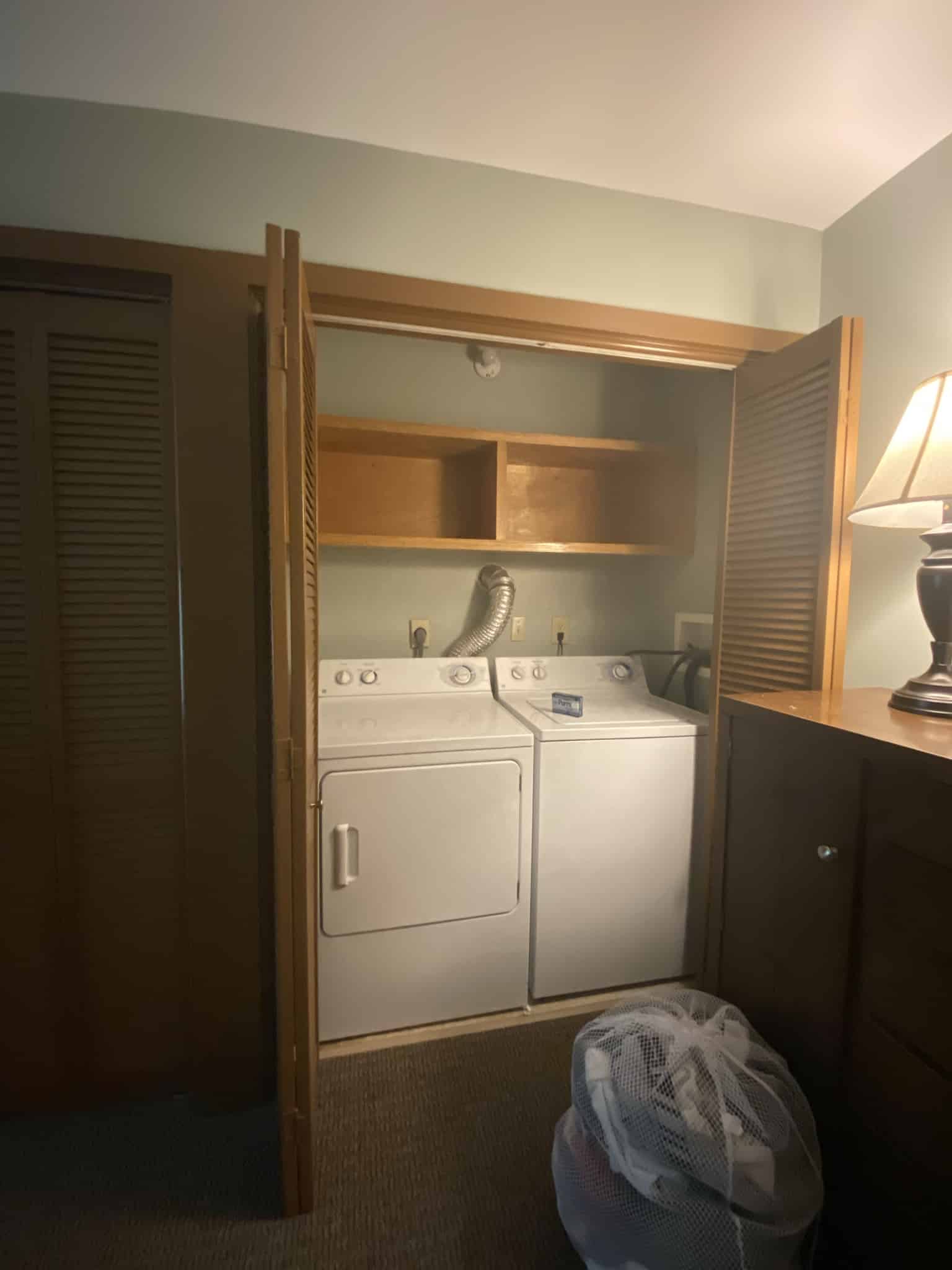 in unit washer and dryer inside of a closet in the master bedroom