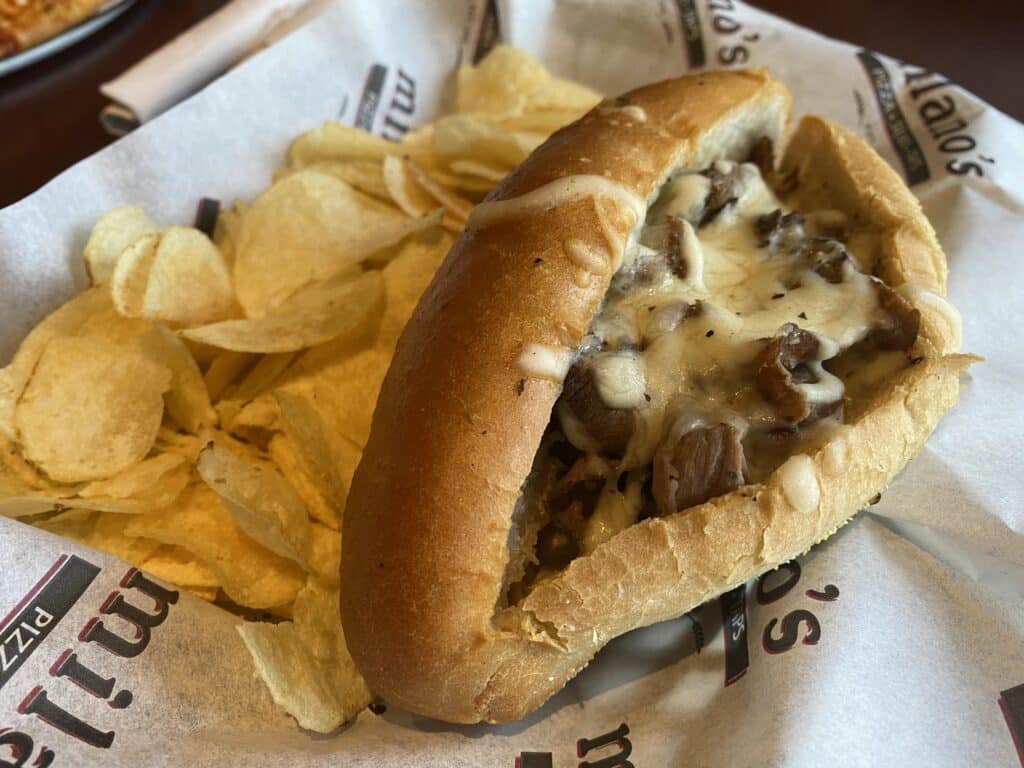 Philly Cheesesteak and chips from Milano's 