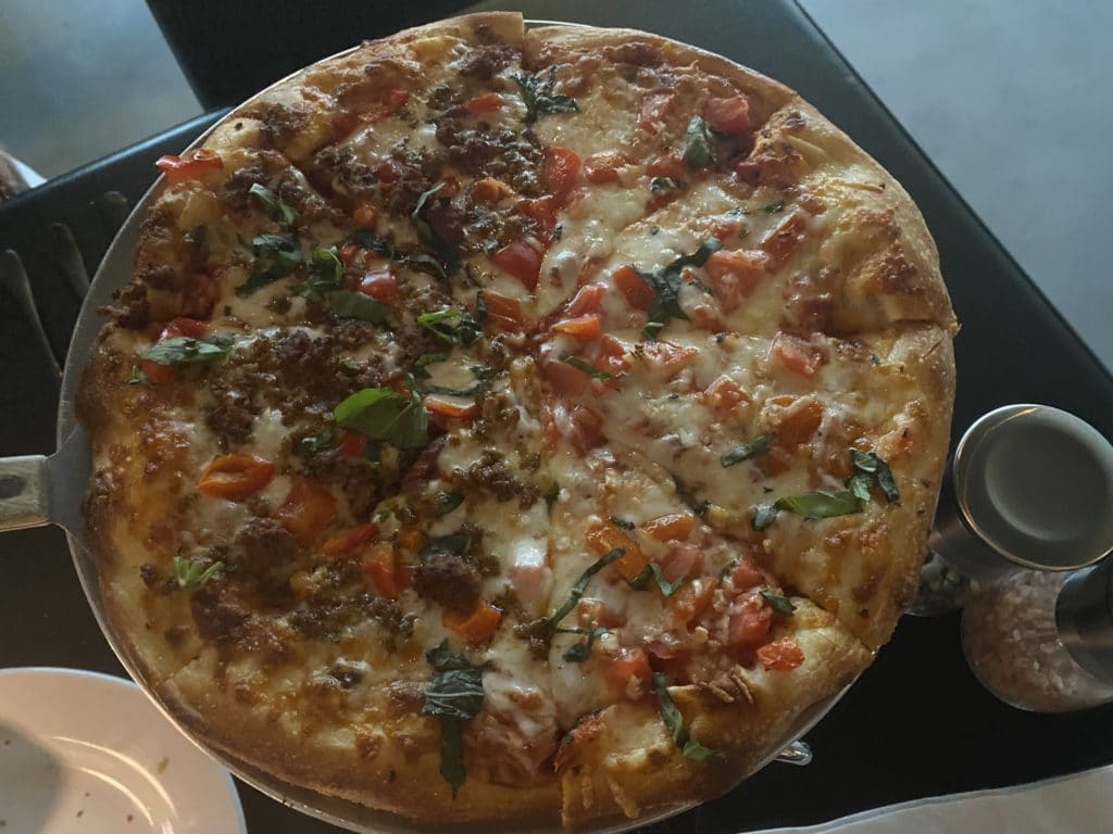 half Margherita style pizza, half meats pizza from Renee's in Tucson
