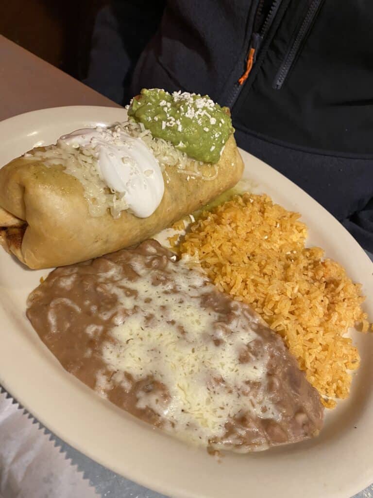 Carnitas Chimichanga with a side of beans and rice from Vaquero Mexican Restaurant