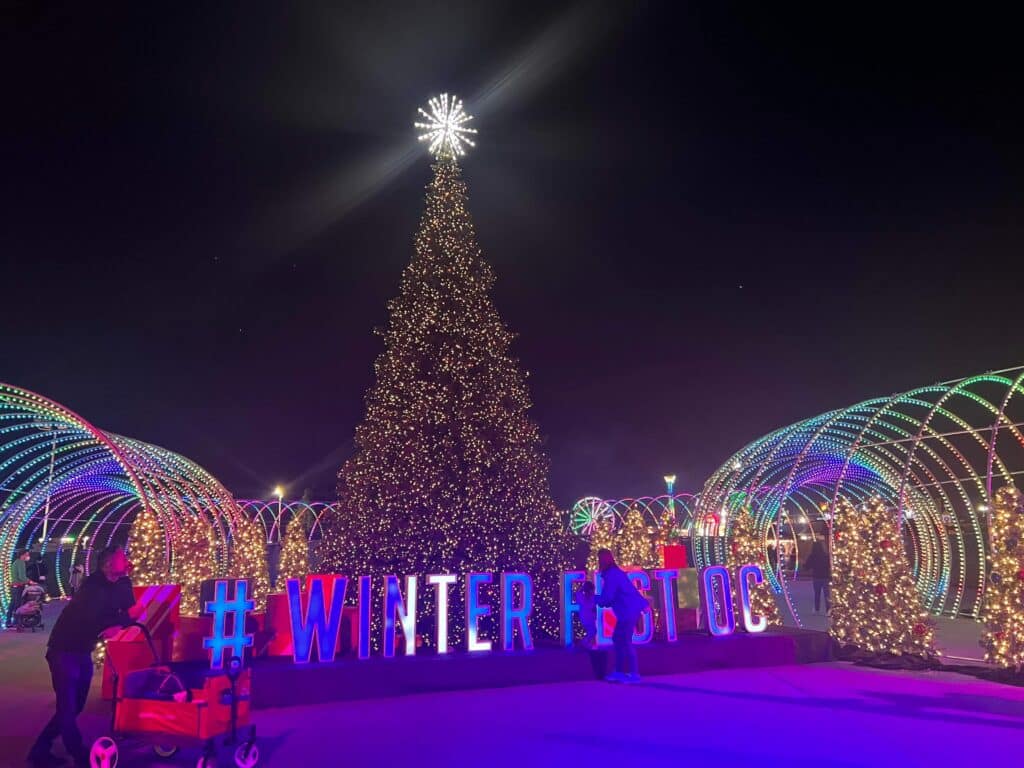Winter Fest OC Entrance Photo Op with Christmas tree and light tunnel