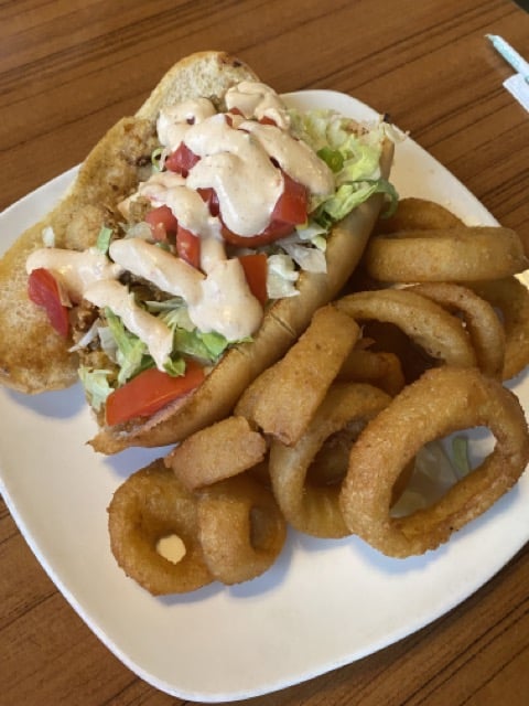 shrimp po' boy and onion rings from Manatee Island Bar & Grill in Fort Pierce, Florida