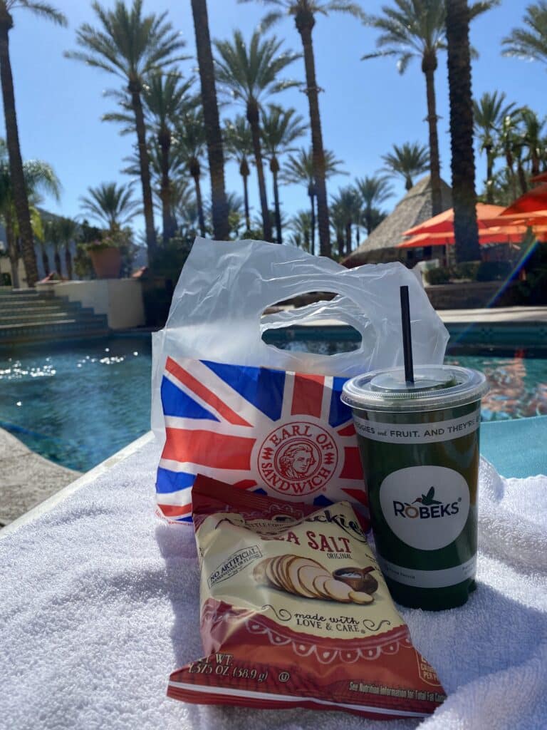 Earl of Sandwich and Robek's Juice to-go containers at the pool