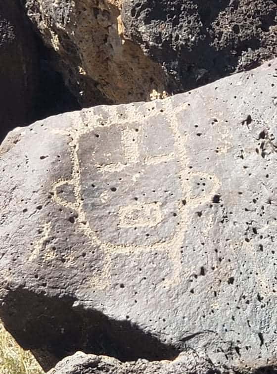 petroglyph of a face at Petroglyph National Monument in Albuquerque New Mexico - Rinconada Canyon Trail
