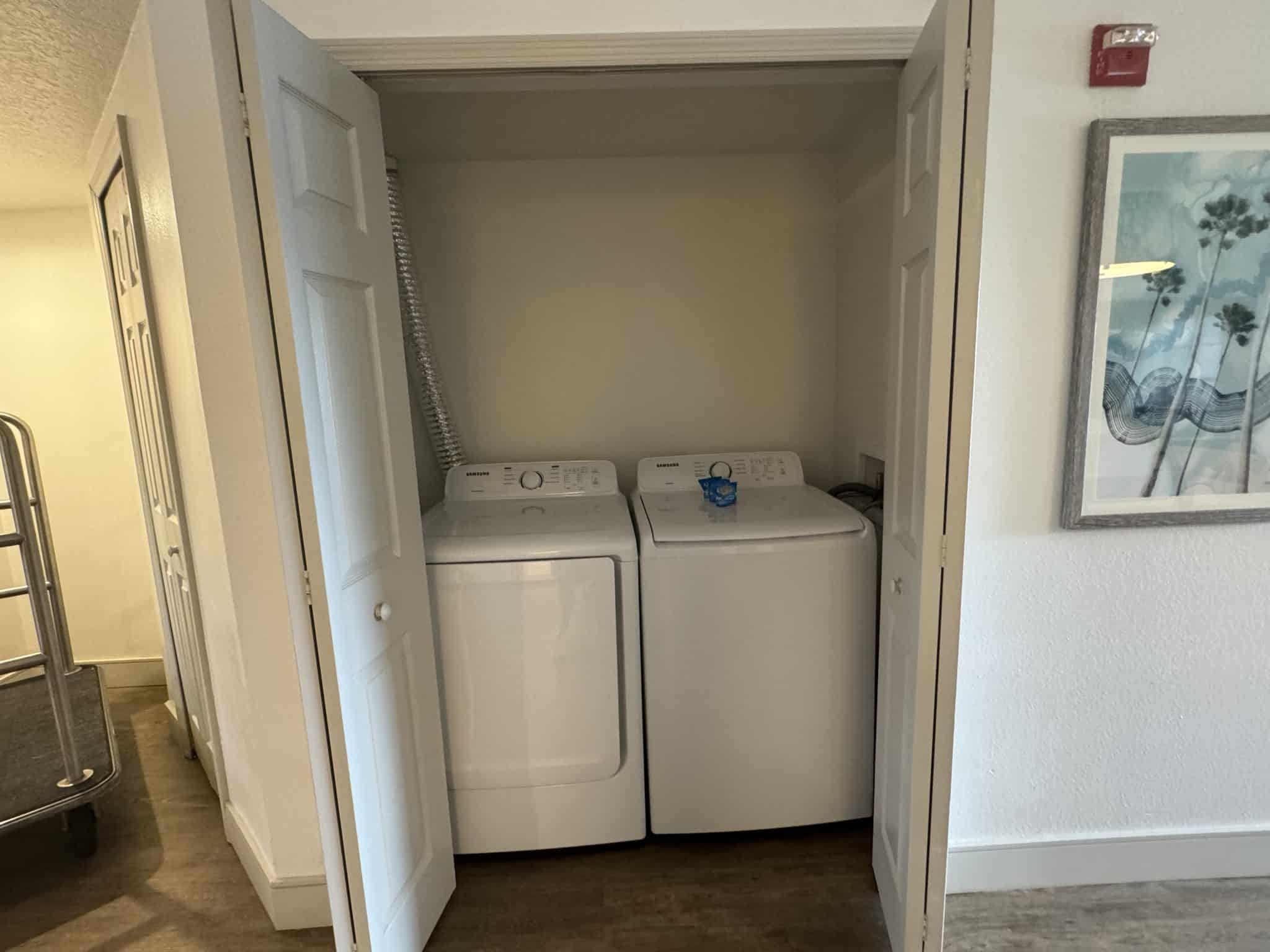 in unit laundry with washer and dryer in a closet