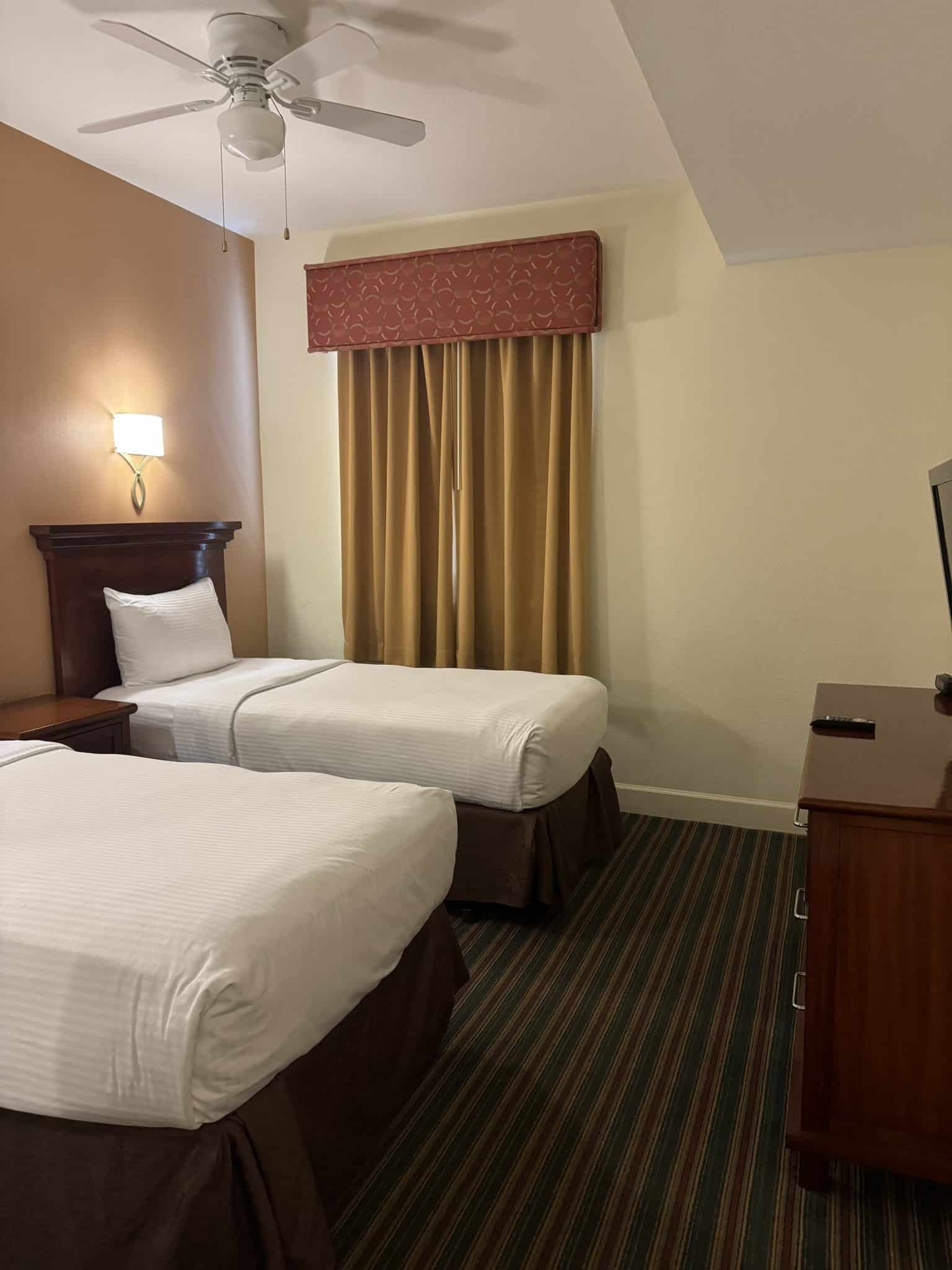 2nd bedroom with 2 twin beds and a tv