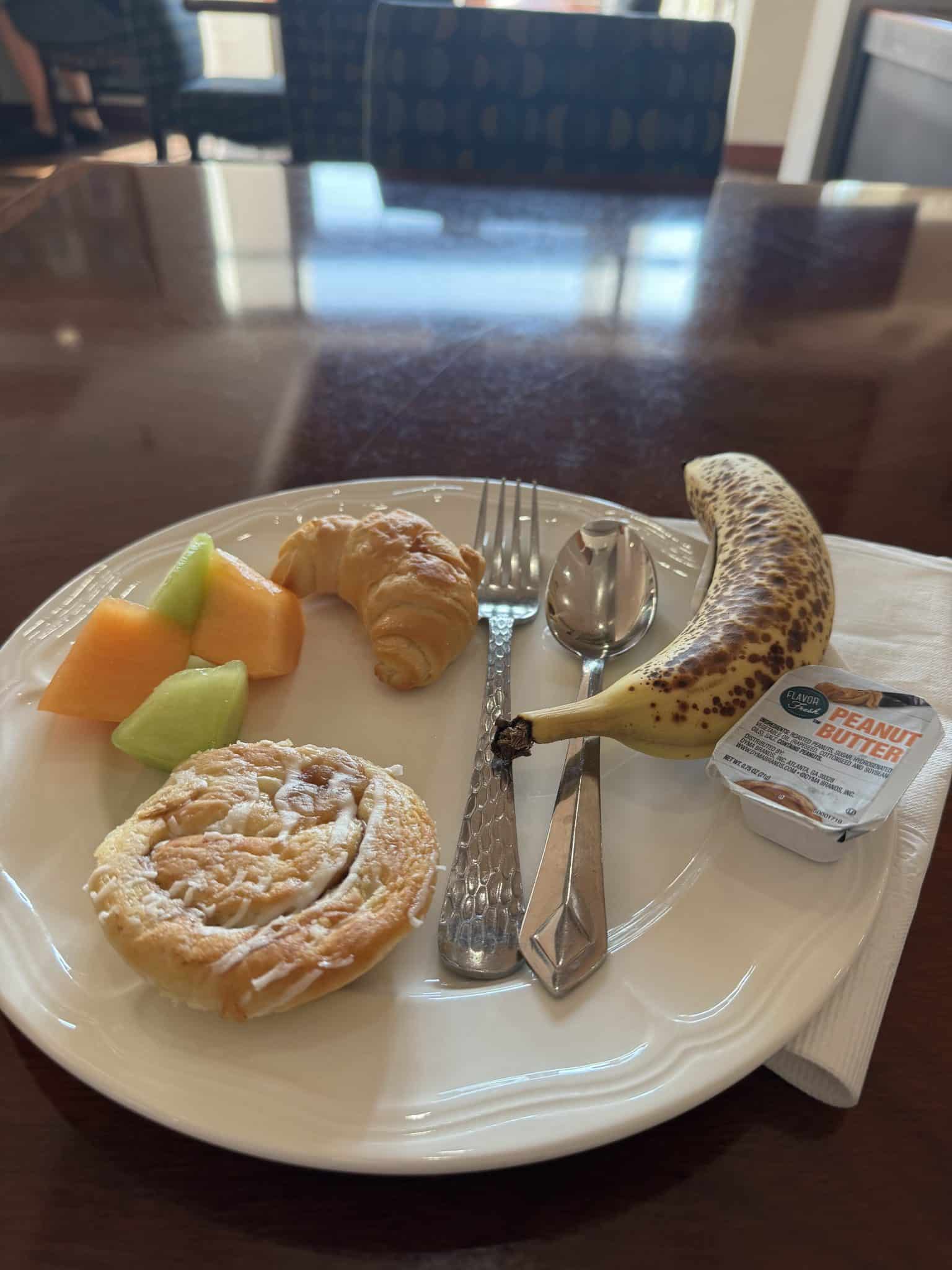 complimentary breakfast buffet with fruit, pastries, and more