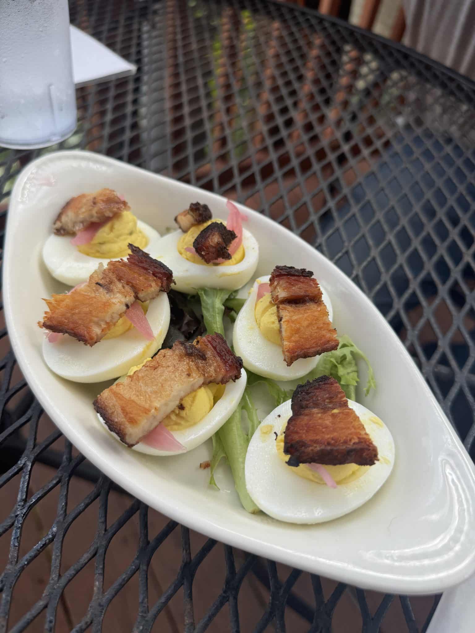 deviled eggs with pork belly and pickled onions from Bourbon on Main in Frankfort, Kentucky