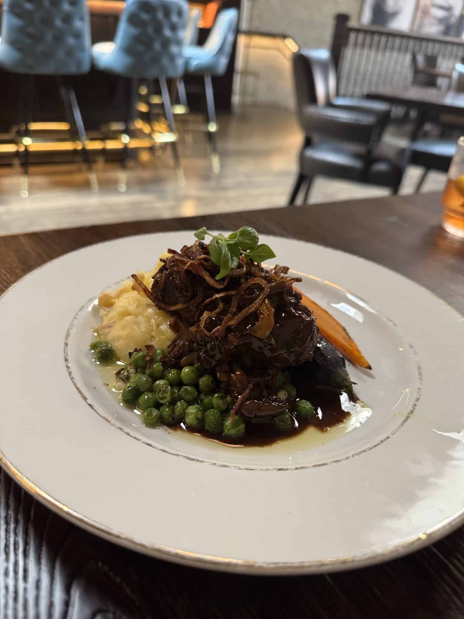 salisbury steak with potatoes and veggies from Scholar restaurant in Grand Rapids