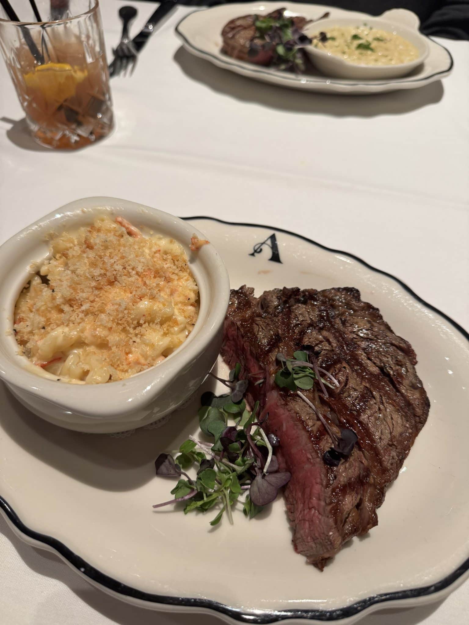 16 oz bone out ribeye, black pepper parmesan risotto, lobster mac n cheese