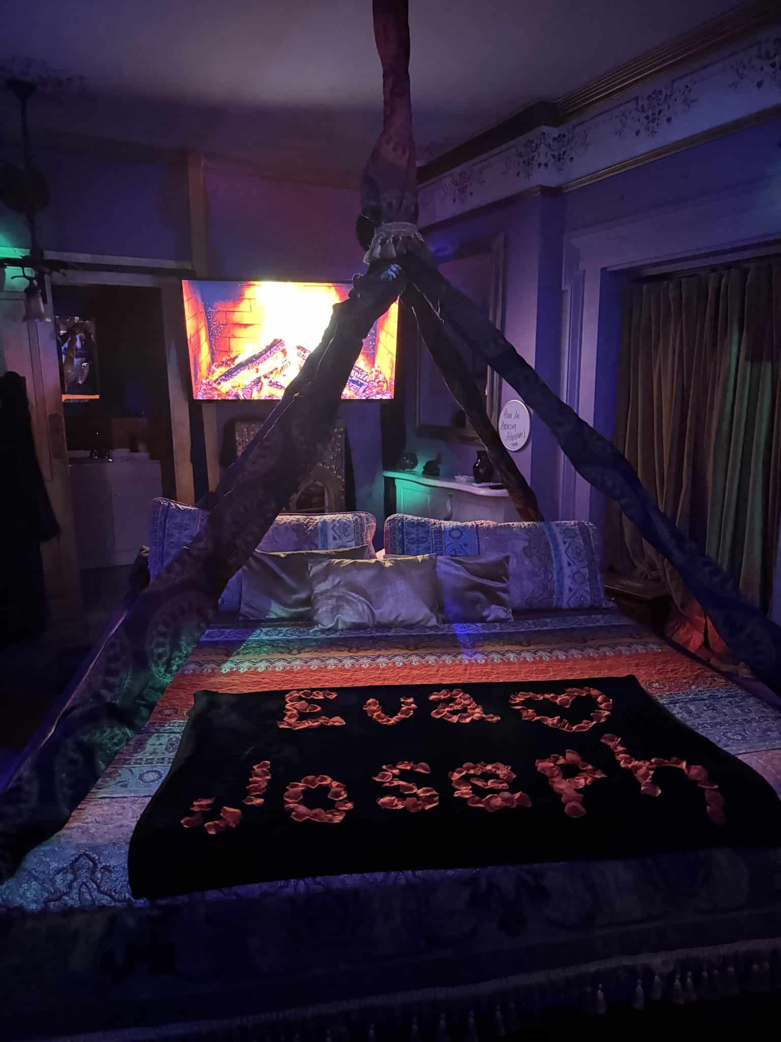 Genie Romance Suite themed room with a floating Flying Carpet themed bed with rose petals of our names