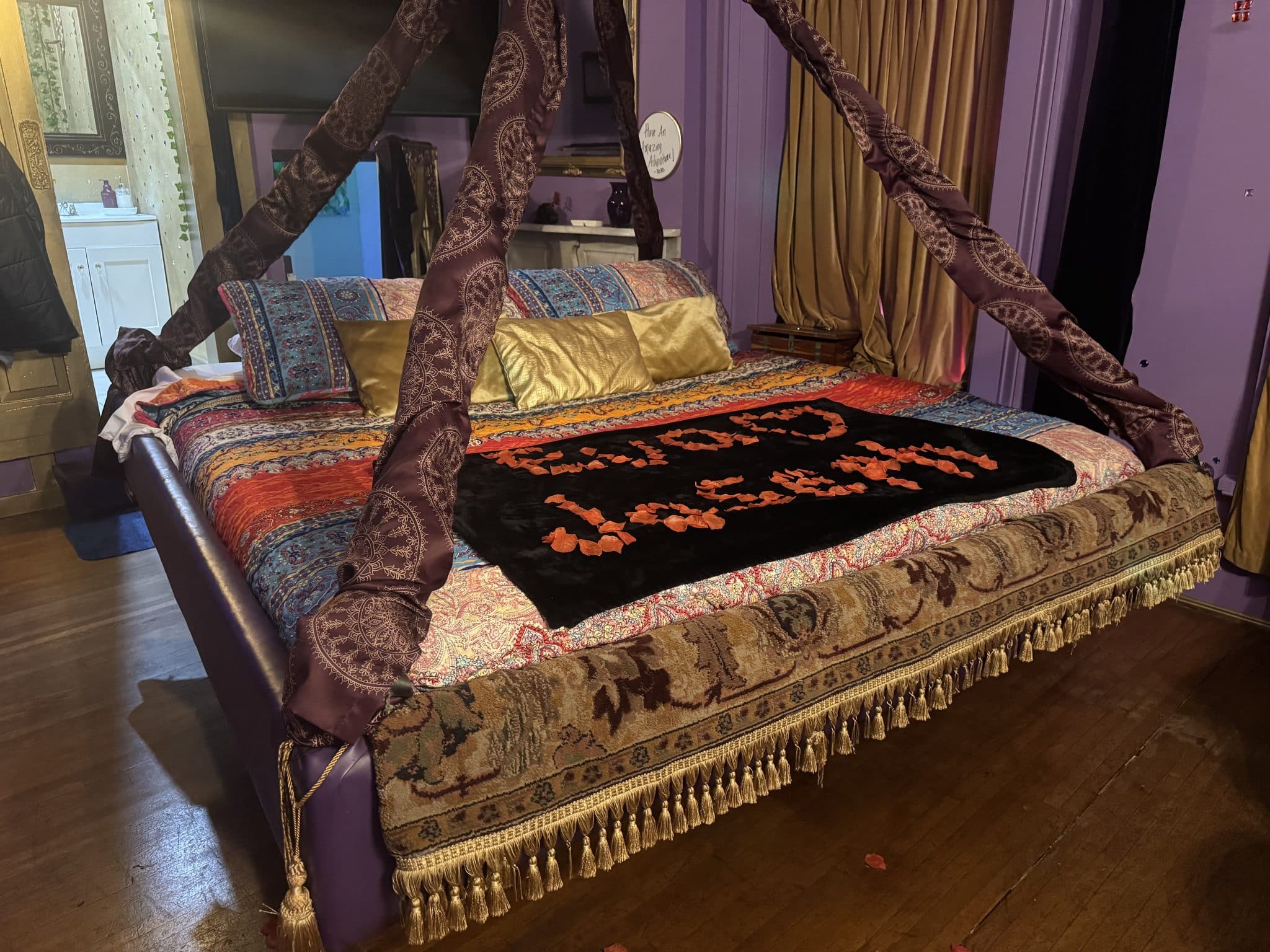 Flying Magic Carpet themed floating bed with rose petals of our names